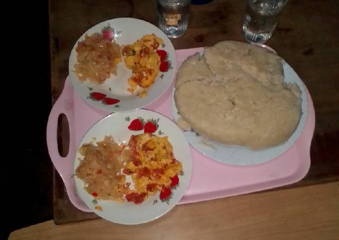 A picture of Prepared Ugali cabbage and fried eggs.