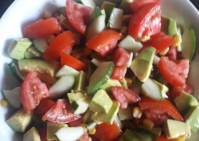 A picture of Tomato, Cucumber, Avocado and Sweetcorn salad.