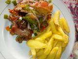 A picture of Chips wit vegetable chicken souce.