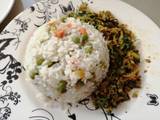 A picture of Vegetable rice with egg fried cabbage.