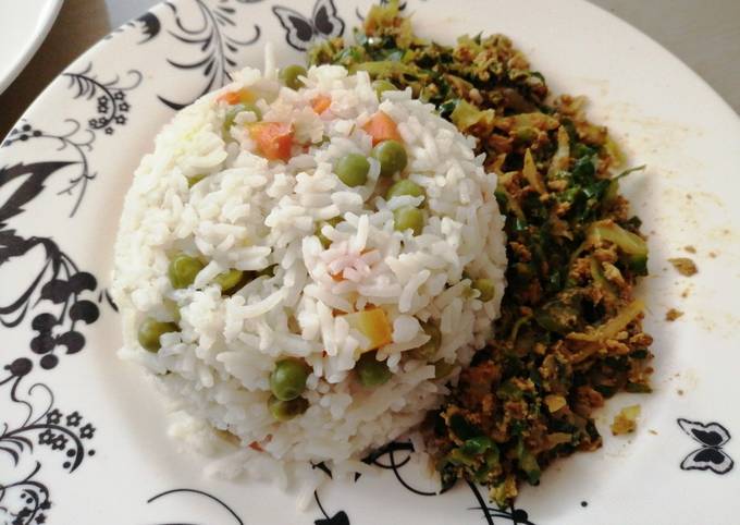 A picture of Vegetable rice with egg fried cabbage.