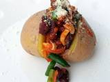 A picture of Baked Potato With Spicy Beans And Vegetable.