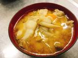 A picture of Miso soup with pork and vegetables   "Tonjiru".