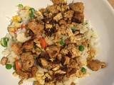 A picture of Fried chicken and rice with vegetables - Chinese cuisine influence .