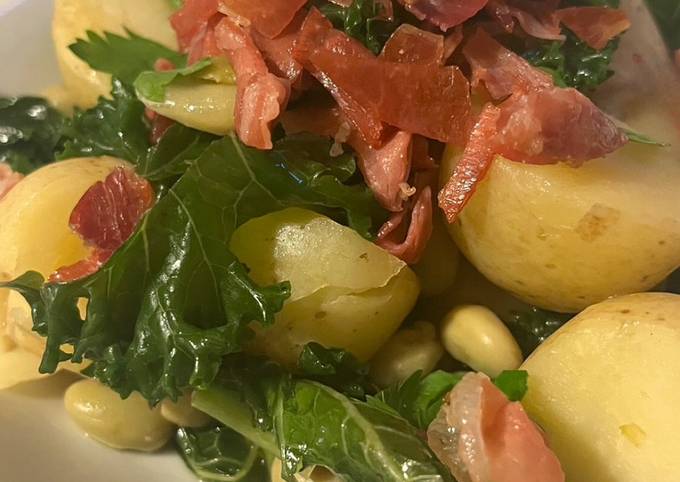 A picture of Crispy Serrano Ham with Kale and Broad Beans.