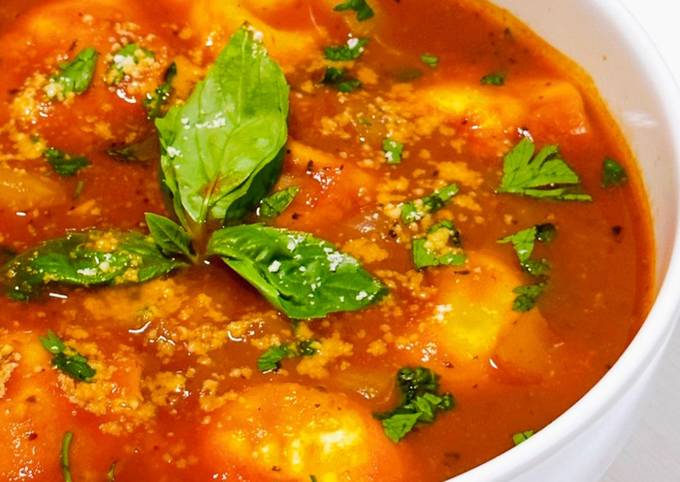 A picture of Four Cheese Ravioli in Tomato Broth.