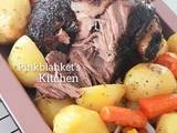 A picture of Slow Roasted Lamb Leg with Potatoes, Peas, Carrots & Corns.