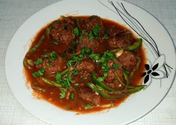 A picture of Spicy Meatballs in tomato sauce.