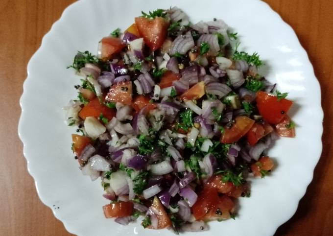 A picture of Onion & tomato' koshimbir' salad 🥗🧅🍅.