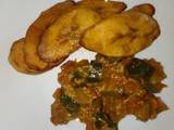 A picture of Breakfast leftover eggplants curry and plantain#Author marathon.