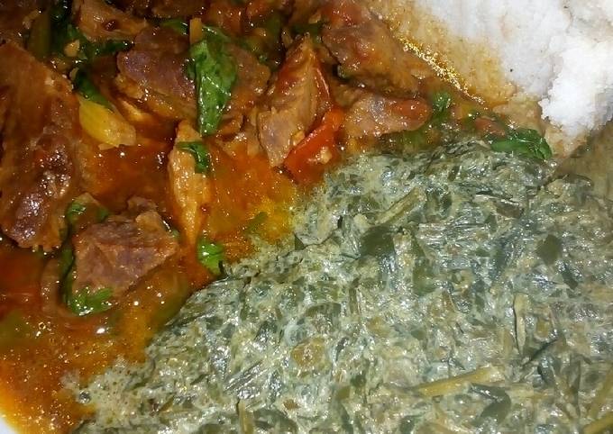 A picture of Wet fried beef,kienyeji veges with ugali.