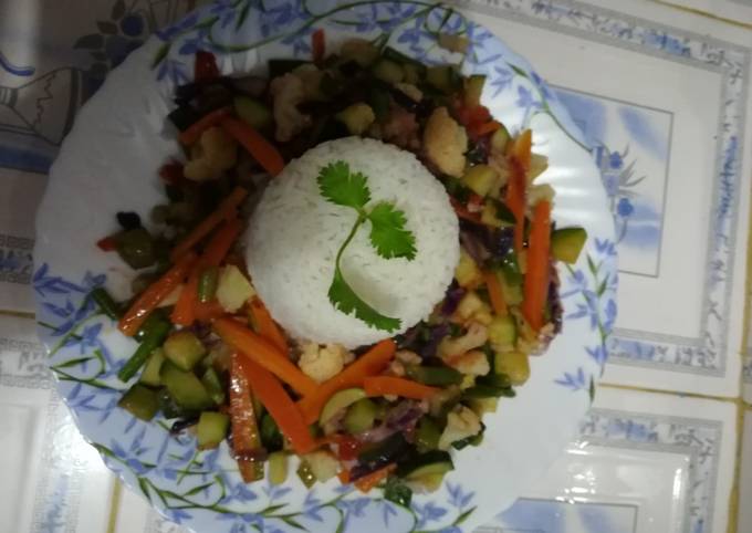 A picture of White rice with veggies.