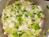 A picture of Steamed cabbages with onions.