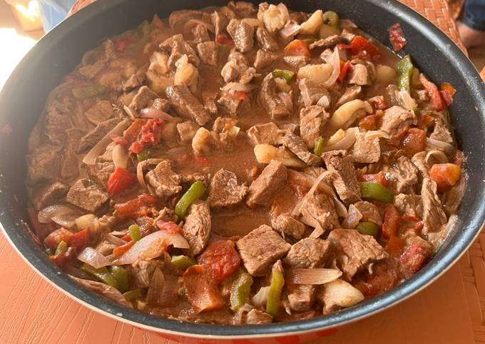 A picture of Lebanese style Mutton meat with veggies.