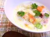 A picture of A chowder full of vegetables with bacon and welsh onions.