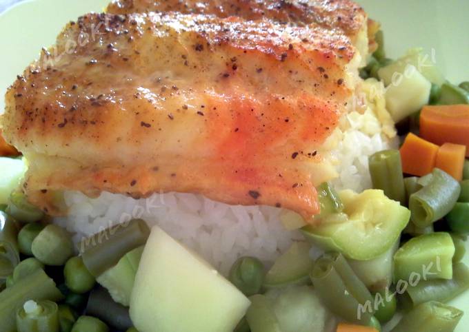 A picture of Broiled white fish over rice and vegetables.