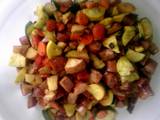 A picture of Roasted kielbasa and vegetables.