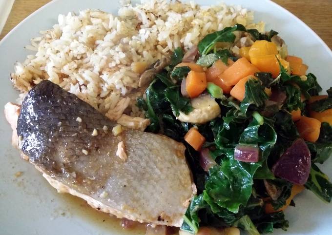 A picture of Baked teriyaki salmon with stir fried vegetables and fried rice.