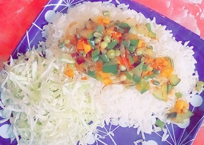 A picture of White Rice with veg source.