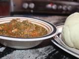 A picture of Pounded yam with vegetable soup.