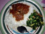 A picture of Rice and stew with vegetable.