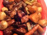 A picture of pork ribs and vegetables.