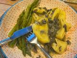 A picture of Truffle tortellini with creamy mushroom and sage sauce, and asparagus side.