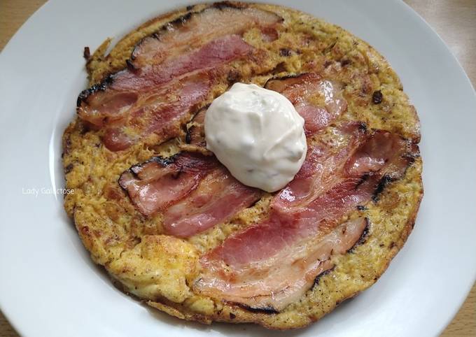 A picture of Omelette with caramelised onion, bacon and oyster sauce.