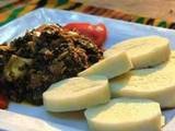 A picture of White yam with vegetable leaf.