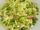 A picture of Steamed cabbage and peas.