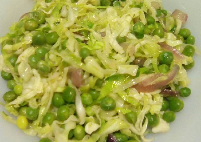 A picture of Steamed cabbage and peas.