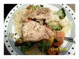 A picture of Baked fish with vegetable pasta.