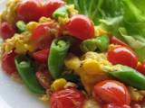 A picture of Scrambed Eggs with Colourful Vegetables and Tuna.