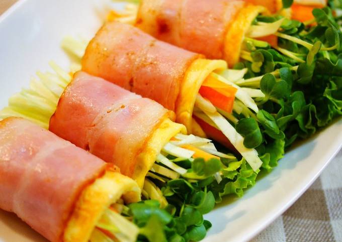 A picture of Raw Vegetables Wrapped with Bacon and Eggs.