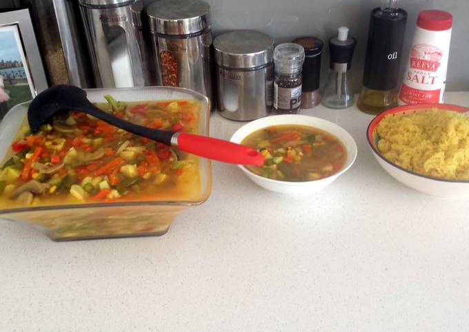 A picture of vegetables with curry rice.