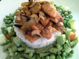 A picture of Grilled chicken with steamed vegetables and rice.