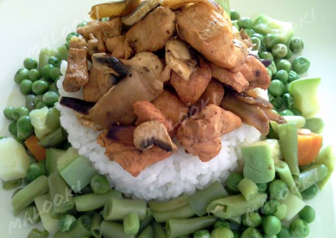 A picture of Grilled chicken with steamed vegetables and rice.