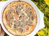 A picture of Vegetarian Mushroom and cherry tomato quiche.