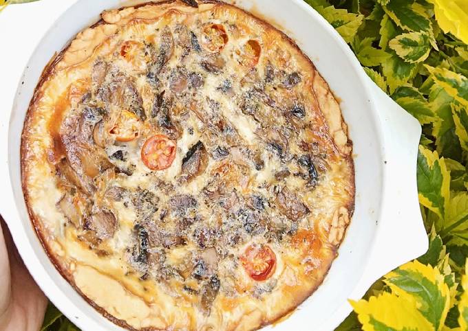 A picture of Vegetarian Mushroom and cherry tomato quiche.