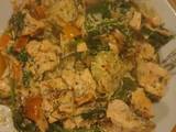 A picture of Salmon with courgettes spinach and orange bell pepper.