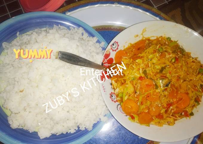 A picture of Rice with vegetables souce.