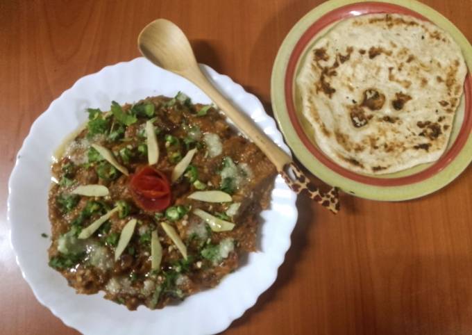 A picture of Baingan da bharta/ mashed grilled aubergines,🍆🧅🍅🌶️.