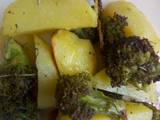 A picture of Potato wedges with broccoli.