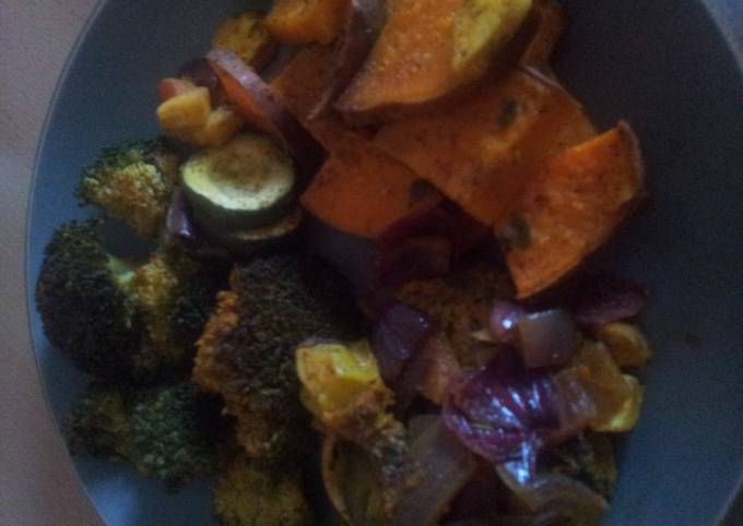 A picture of Roasted vegetables and chicken.