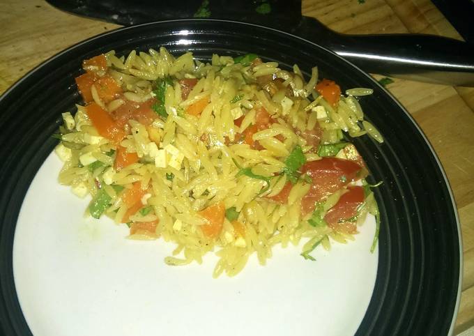 A picture of Orzo and vegetables warm salad.