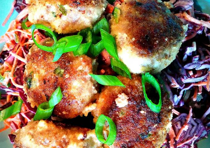 A picture of Thai-inspired pork meatballs with sesame-soy shredded vegetables.