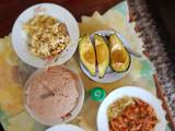 A picture of Dry and wet eggs with cabbages,avocadoes and ugali.