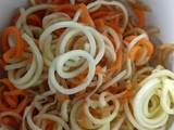 A picture of Carrot, courgette and apple salad with honey lemon dressing.