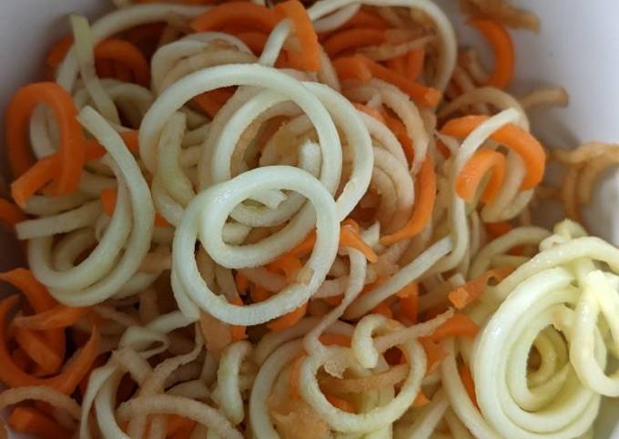 A picture of Carrot, courgette and apple salad with honey lemon dressing.