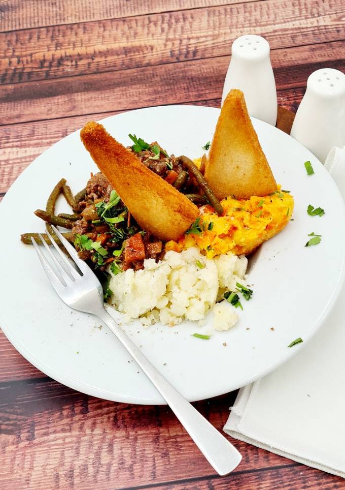 A picture of Savoury minced beef and mashed potatoes with creamed carrots and swede.